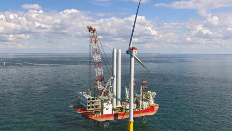 Floating offshore wind turbine and construction vessel in open water